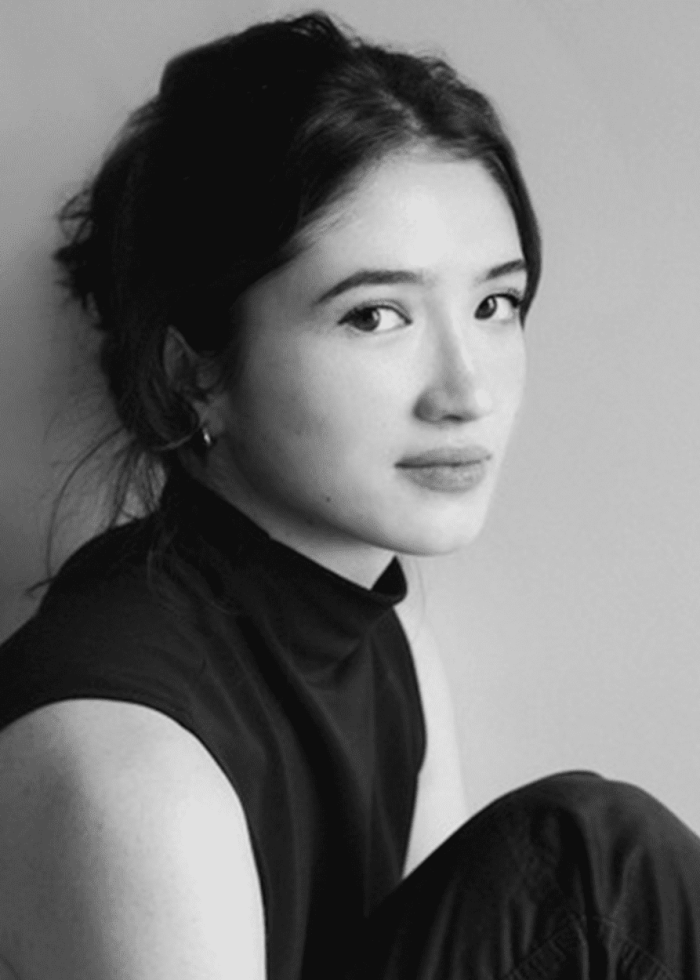 Haley Wong portrait, looking towards the camera, wearing a black turtleneck.
