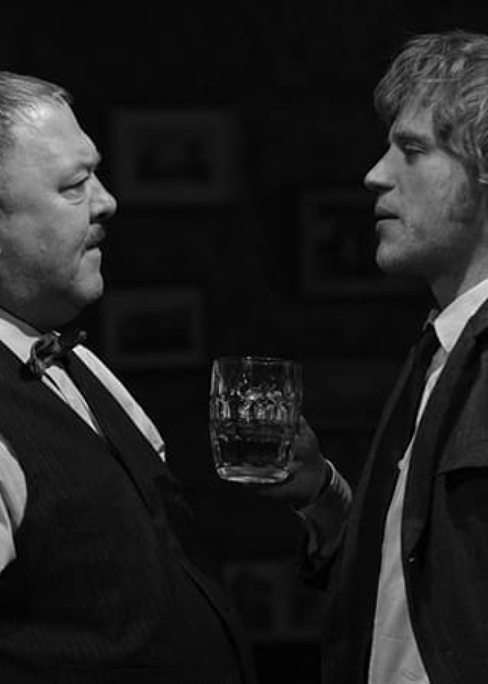 Two actors in a scene from Hangmen, a top theater production.