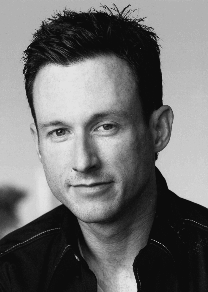 Brad Heberlee, a man with dark hair, looking at the camera.