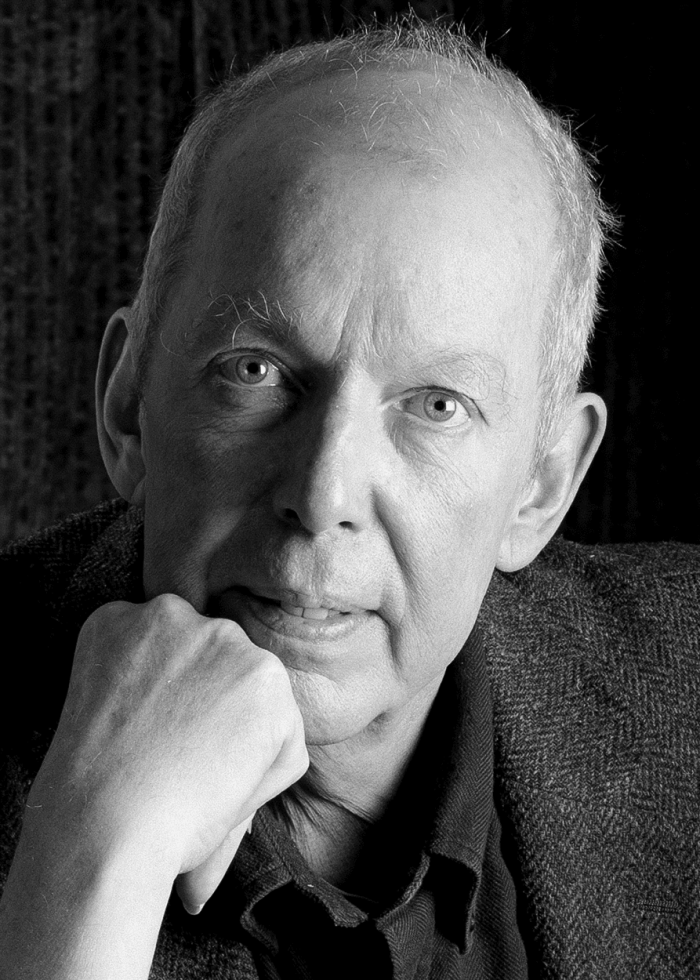 Jonathan Hogan portrait, black and white, looking directly at the camera.