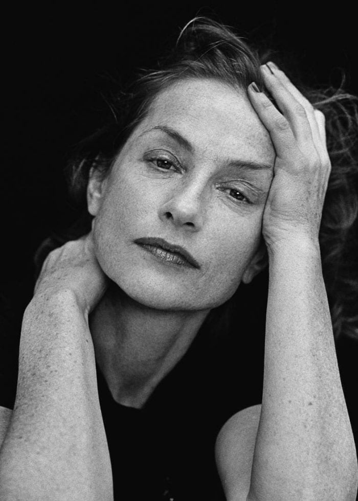Isabelle Huppert portrait in black and white, looking directly at the camera
