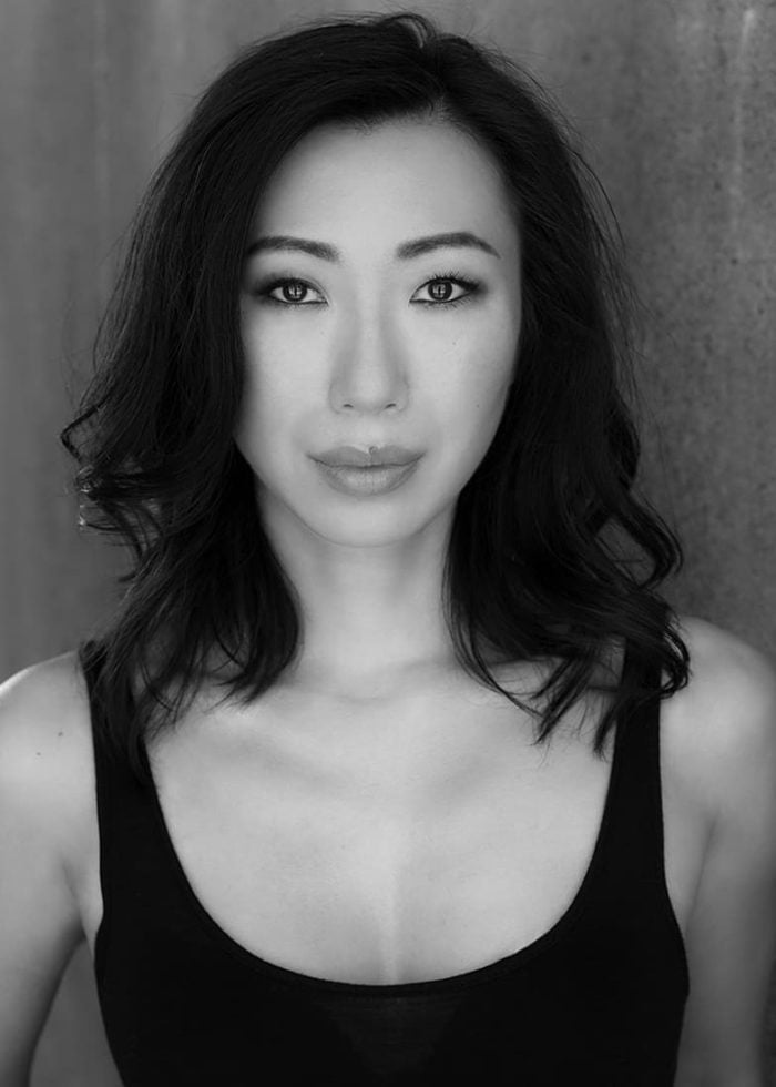 Jo Mei, actress, in a black tank top, looking directly at the camera.