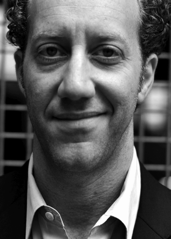 Joey-Slotnick Joey Slotnick smiling, close-up portrait in black and white