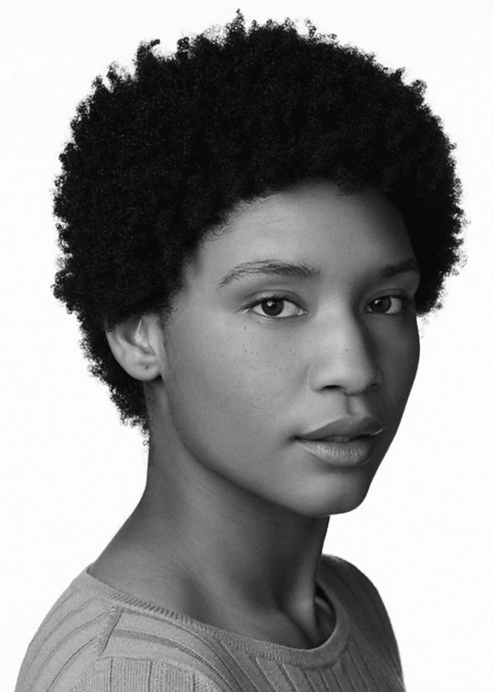 Black and white headshot of Jules Latimer with short, natural hair.