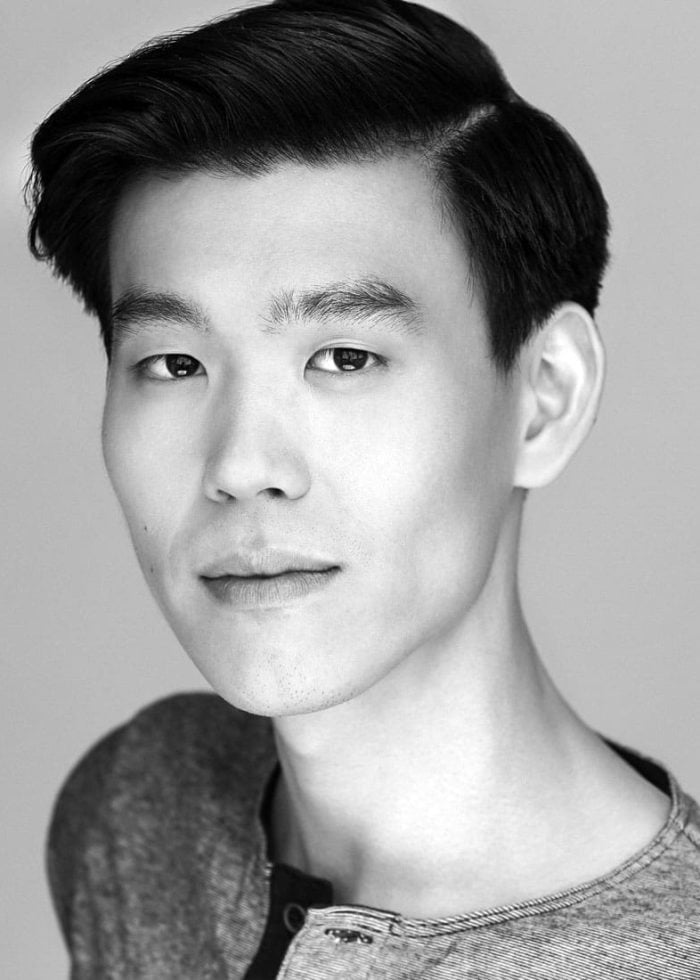 Headshot of Justin Chiao, Asian actor with dark hair and a serious expression.