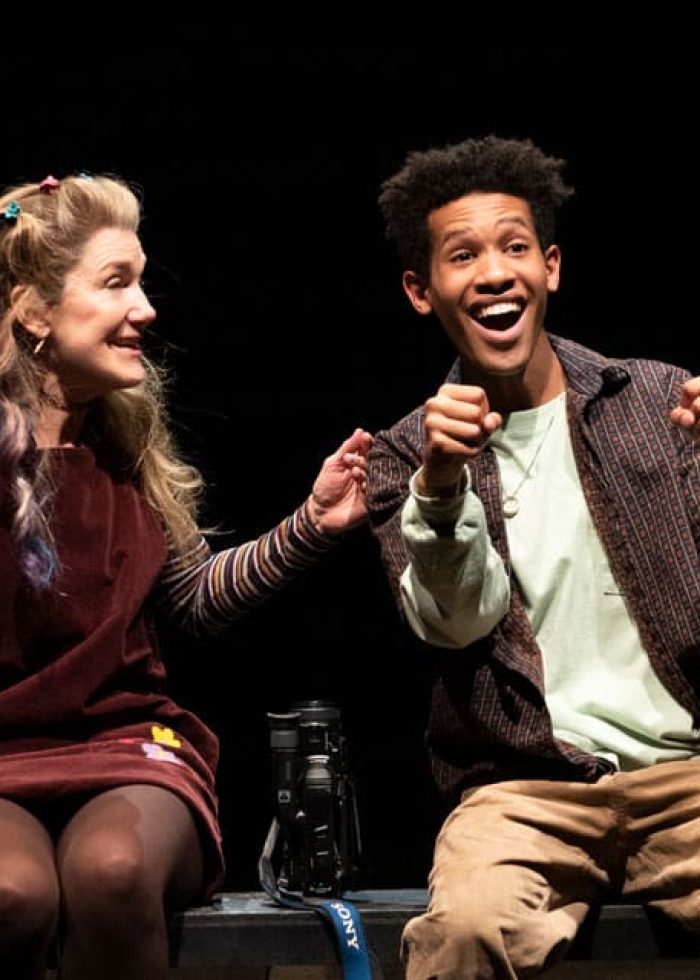 Actors from Kimberly Akimbo on stage, smiling and interacting with each other.