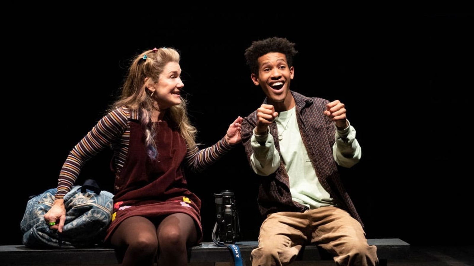 Actors from Kimberly Akimbo on stage, smiling and interacting with each other.