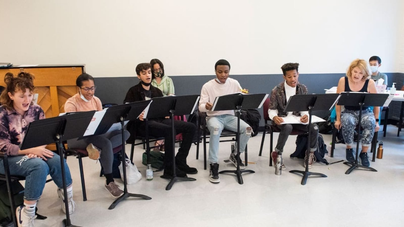 Cast of Kimberly Akimbo rehearsing musical numbers.