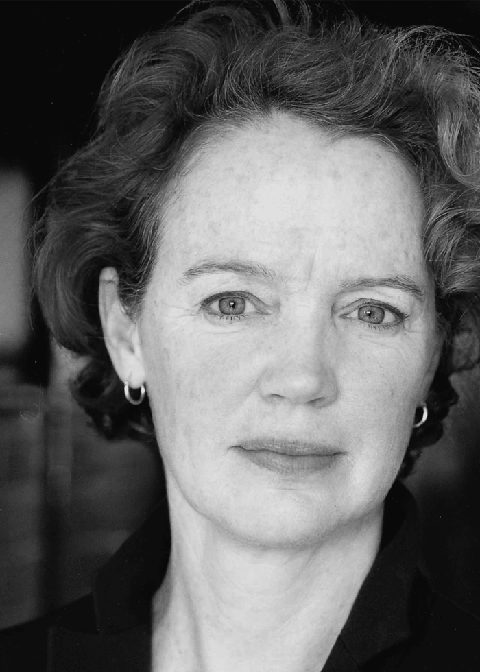 Kristin Griffith, actress, in a black and white headshot portrait, looking directly at the camera.