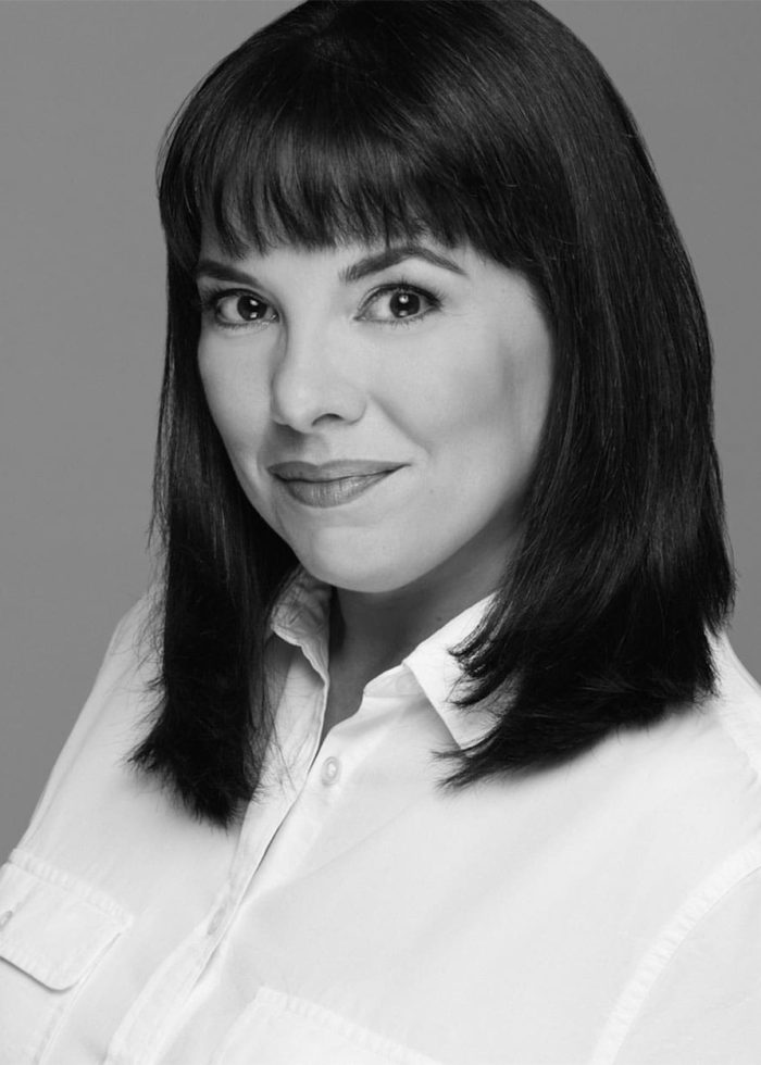 Lee Cataluna portrait, smiling in a white shirt