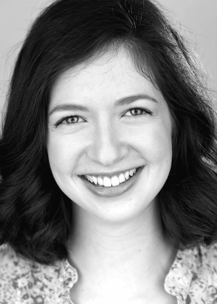 Smiling Lily Fryburg with dark hair and a warm smile