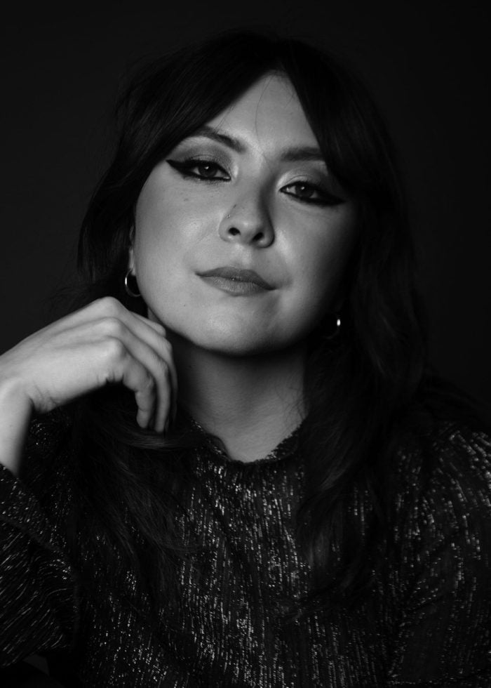 Banna Desta portrait: Woman with dark hair and dramatic eye makeup