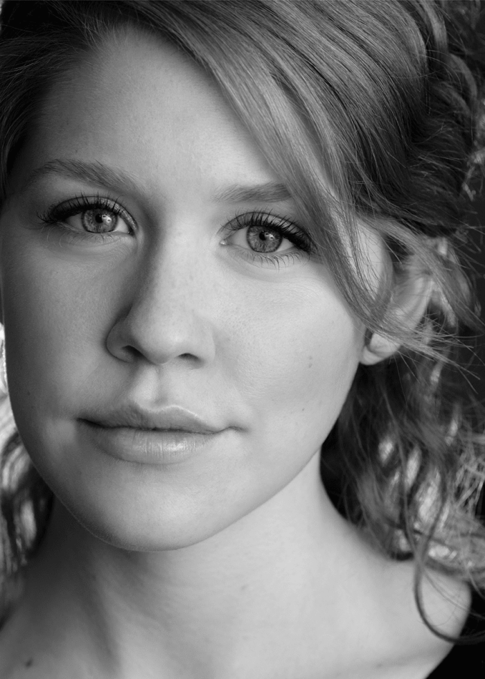 Close-up portrait of Lisa Joyce with soft lighting and a gentle expression.