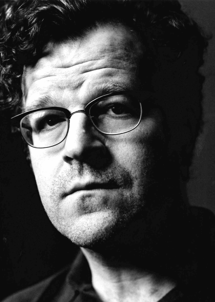 Kenneth Lonergan, playwright and screenwriter, in a black and white portrait.