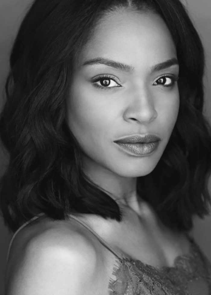 Margaret Odette in a headshot, looking directly at the camera