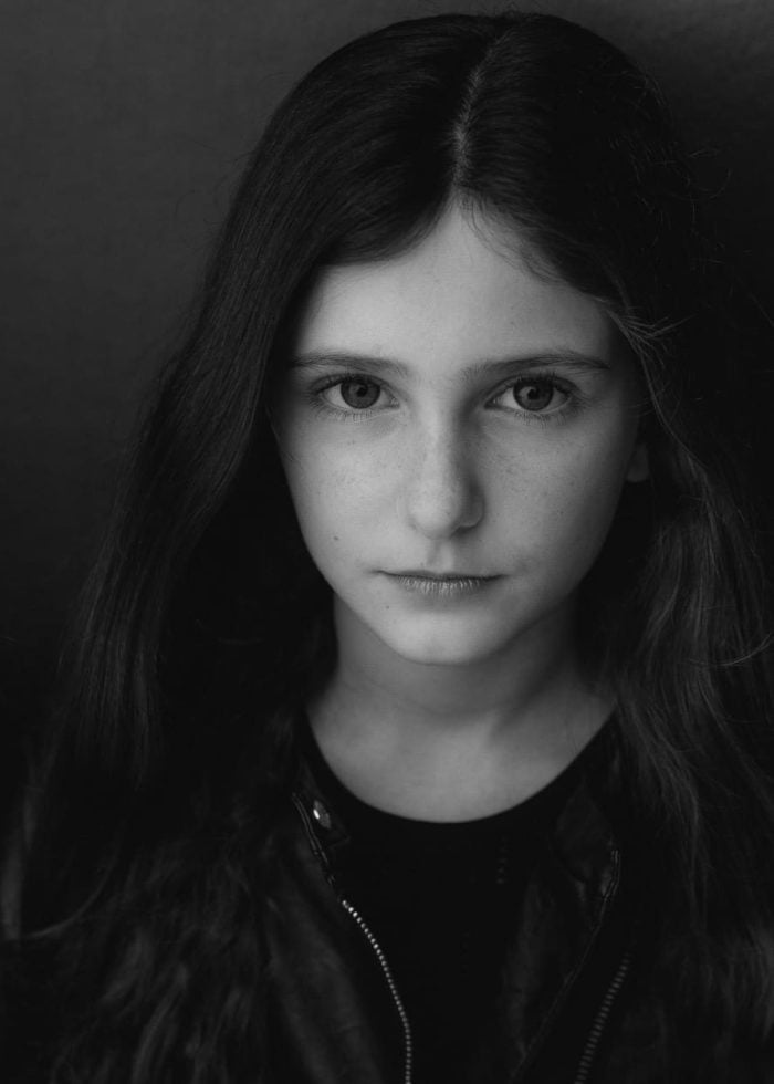 Young girl with long hair, portrait in black and white.