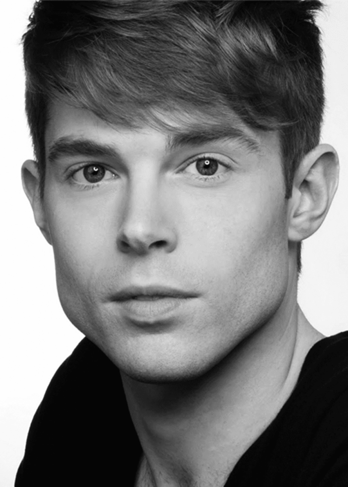 Close-up portrait of Preston Martin, a young man with short hair.