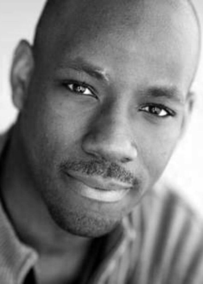 Maurice Jones, actor, close-up portrait with a subtle smile