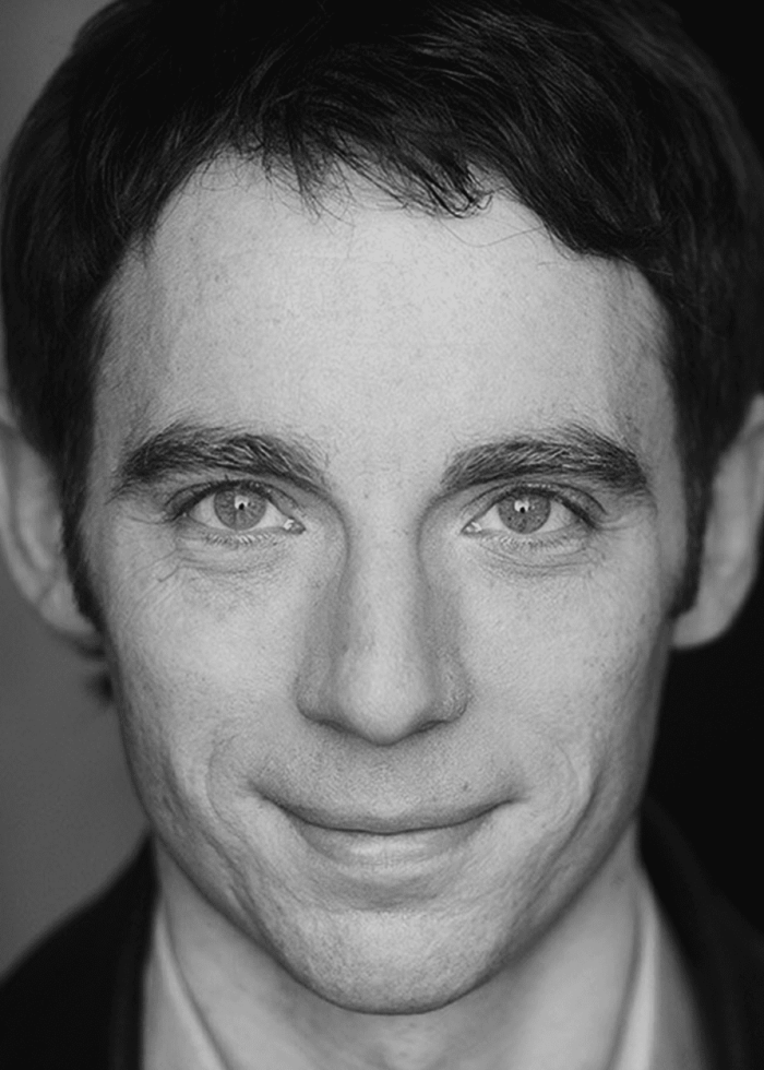 Close-up portrait of Max Gordon Moore, smiling