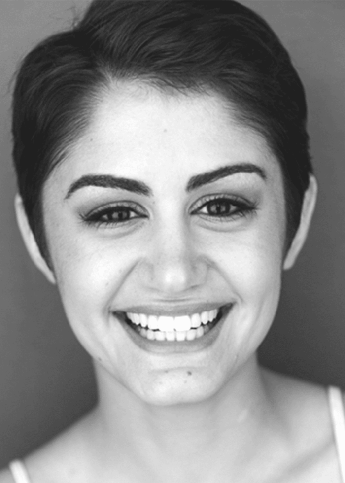 Melissa Mahoney smiling, close-up portrait with short hair