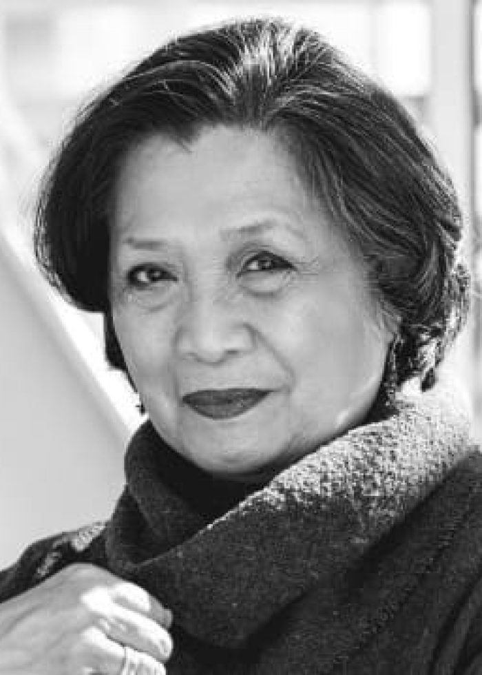 Mia Katigbak, actress, in a black and white portrait, looking at the camera.