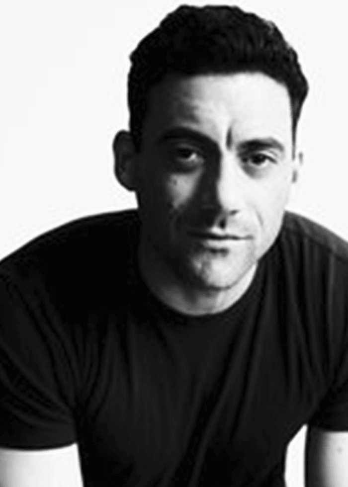 Morgan Spector in black and white portrait, looking directly at the viewer.