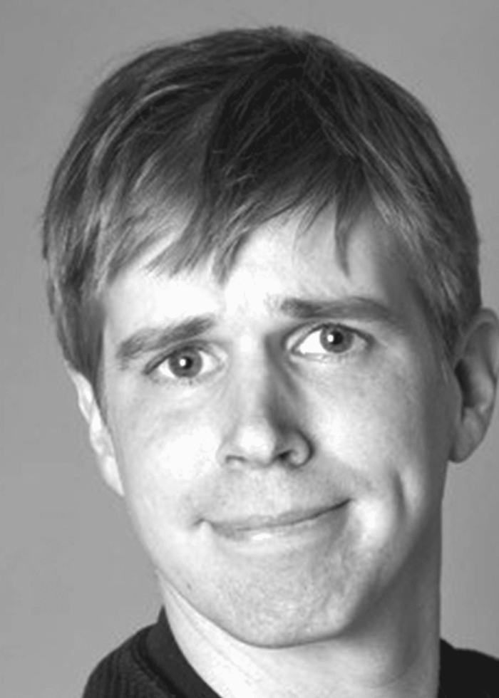 Nate Weida, smiling with a slight smirk, looking at the camera.