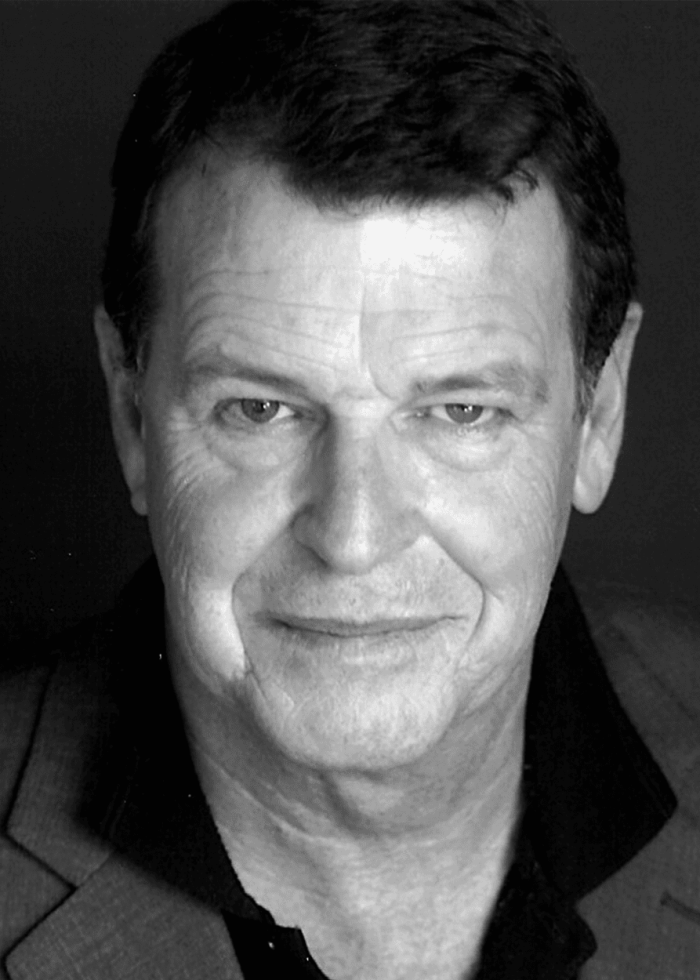John Noble, actor, in a close-up portrait smiling