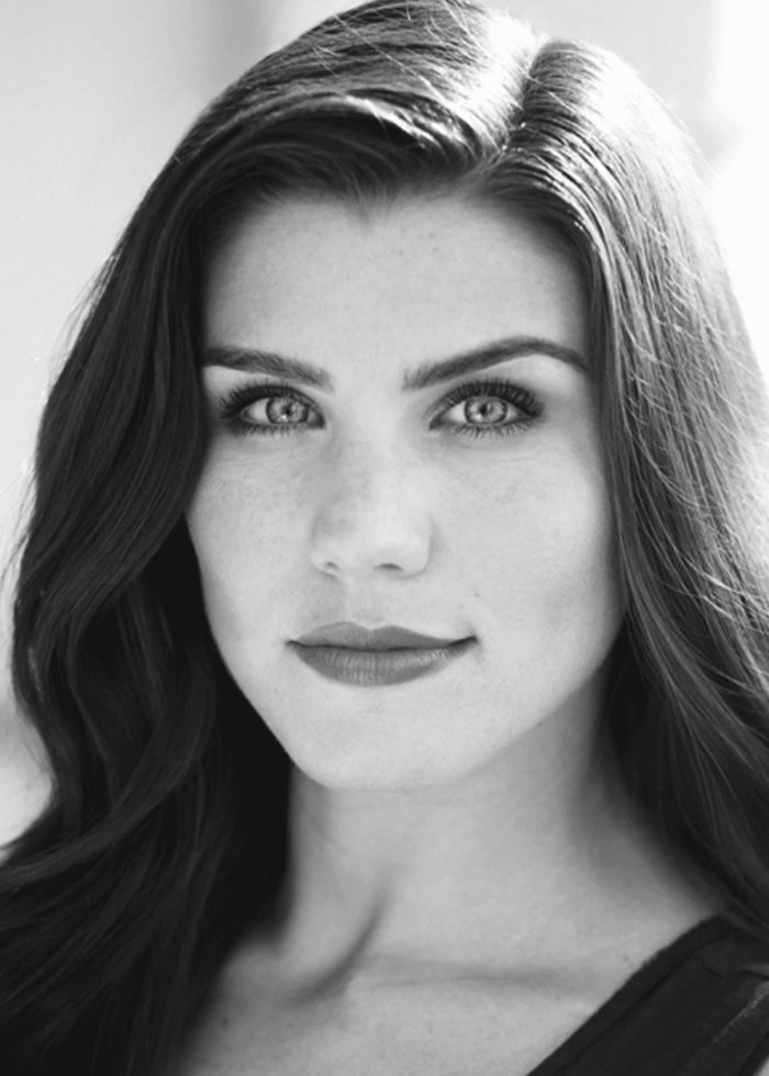 Jen Olivares portrait: Beautiful woman with dark hair and a thoughtful expression.