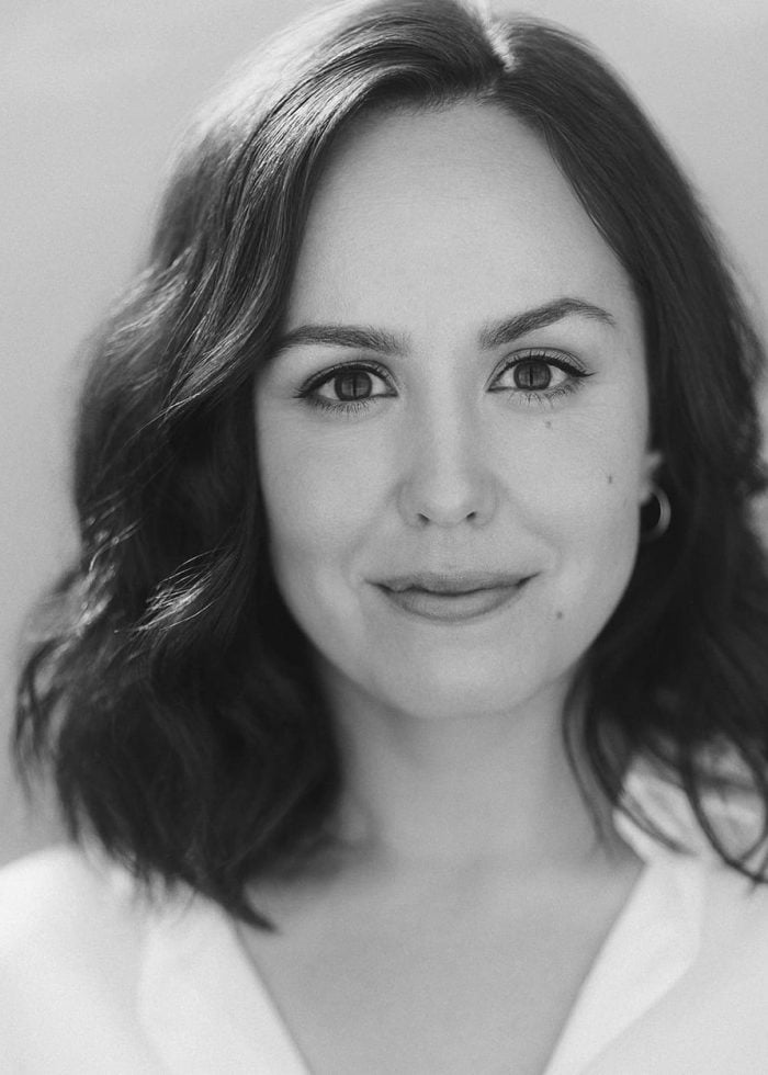 Olivia Hernandez portrait: Woman with dark hair smiling at the camera.