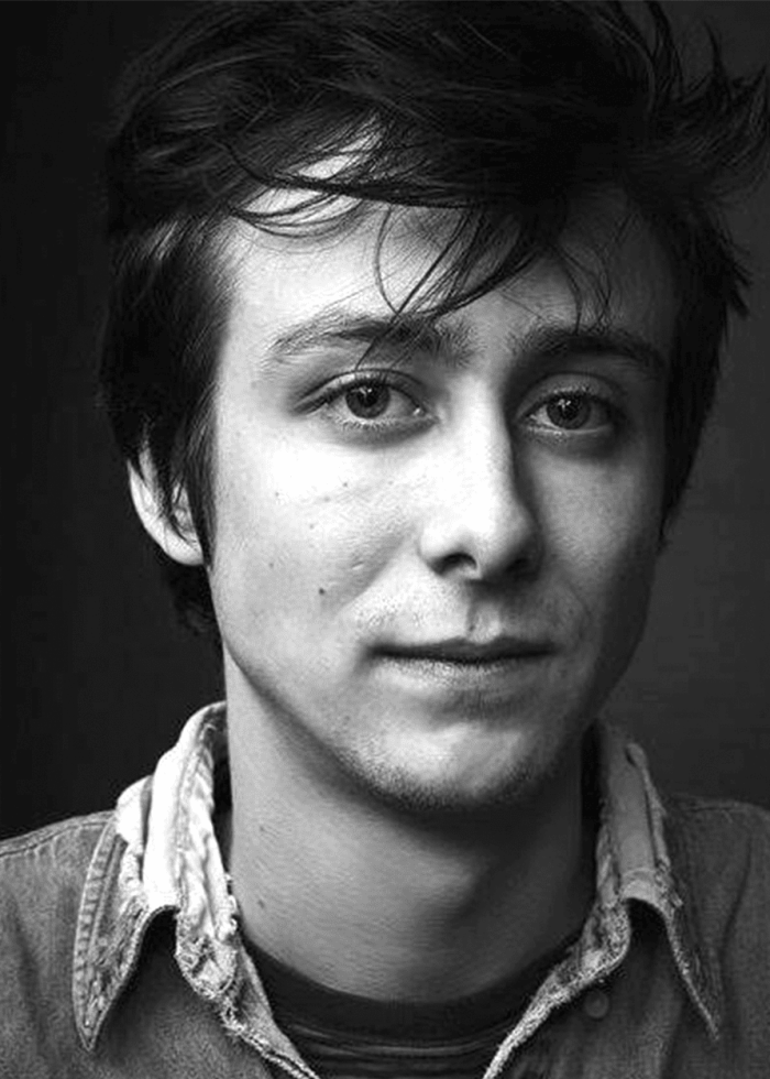 Owen-Campbell Owen Campbell portrait in black and white, looking directly at the camera.