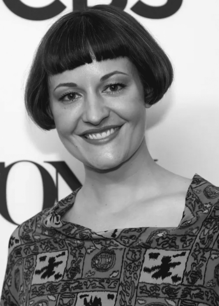 Palmer Hefferan smiling at the camera with a bob haircut