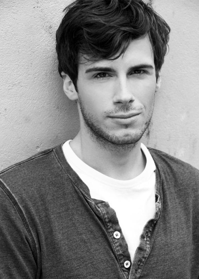 Zane Pais portrait: Handsome man in casual shirt looking at the camera.