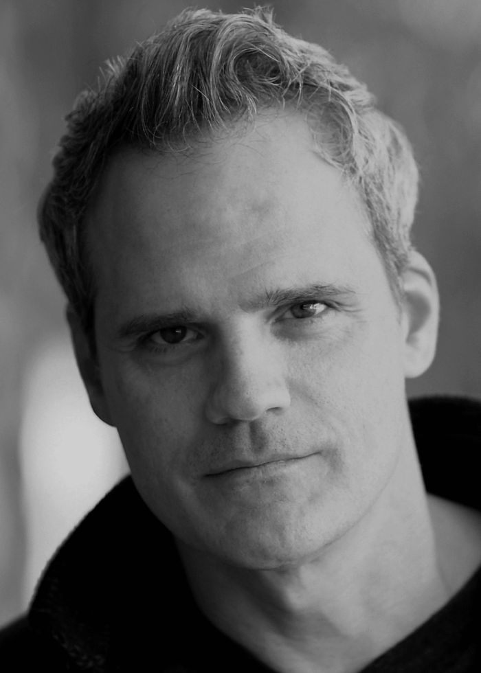 Michael Park in a close-up portrait, looking directly at the viewer.