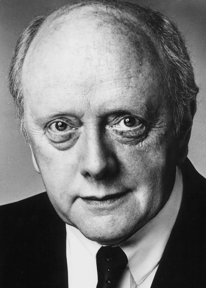 Peter-Maloney-Headshot Close-up portrait of actor Peter Maloney wearing a suit and tie