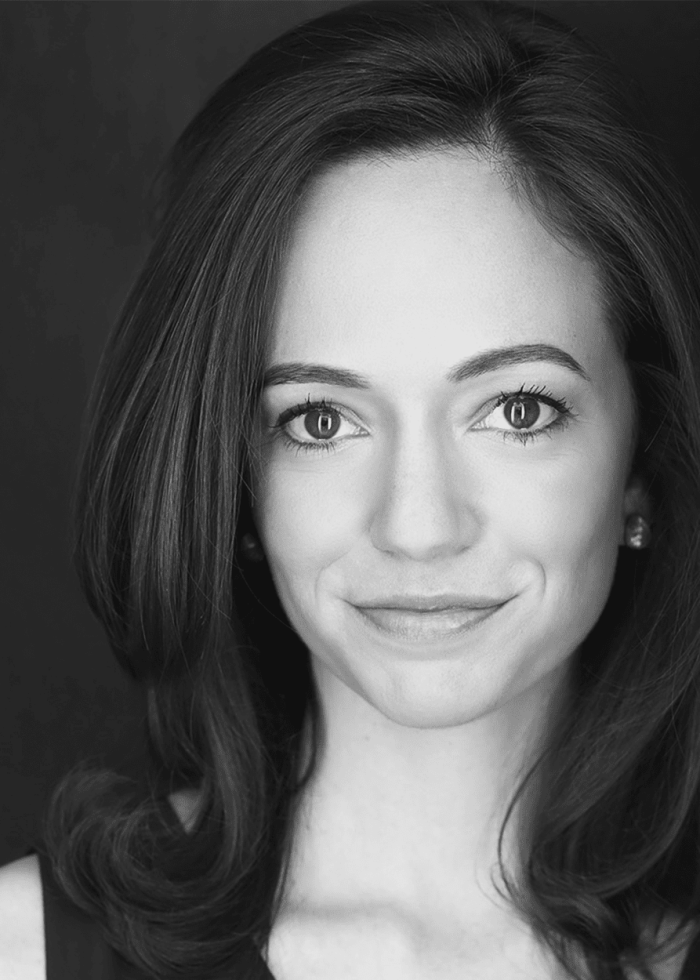 Rachel Prather smiling for a headshot, with dark hair and a soft expression.