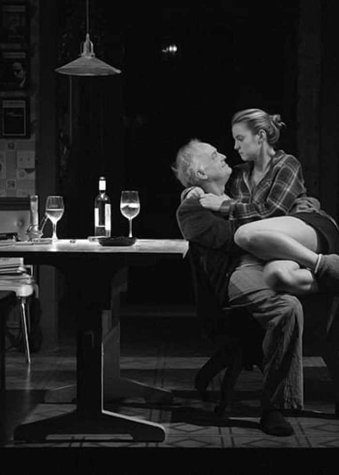 Man and woman in intimate embrace, scene from 'I’m Gonna Pray for You So Hard'.