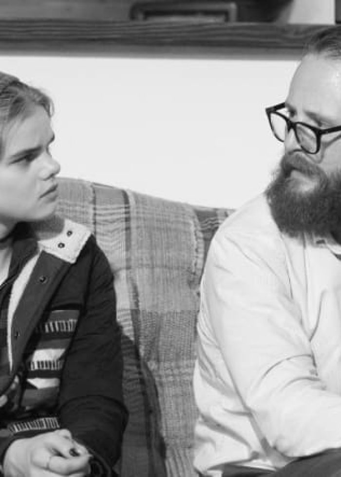 Young person and man in discussion, possibly in Joppa Illinois.