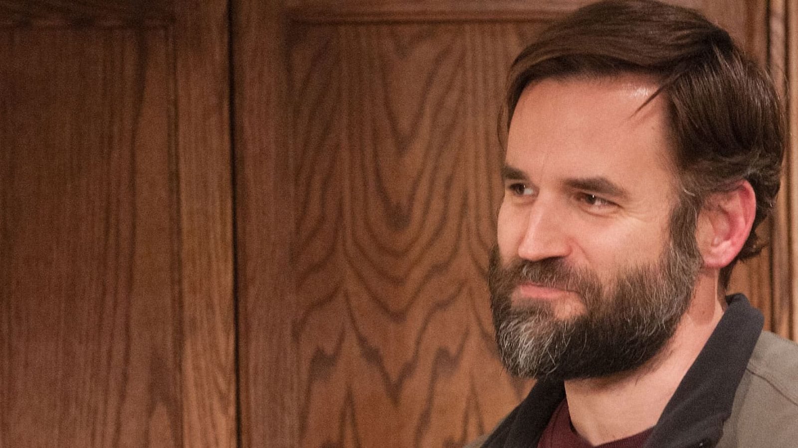 Man with beard looking thoughtfully