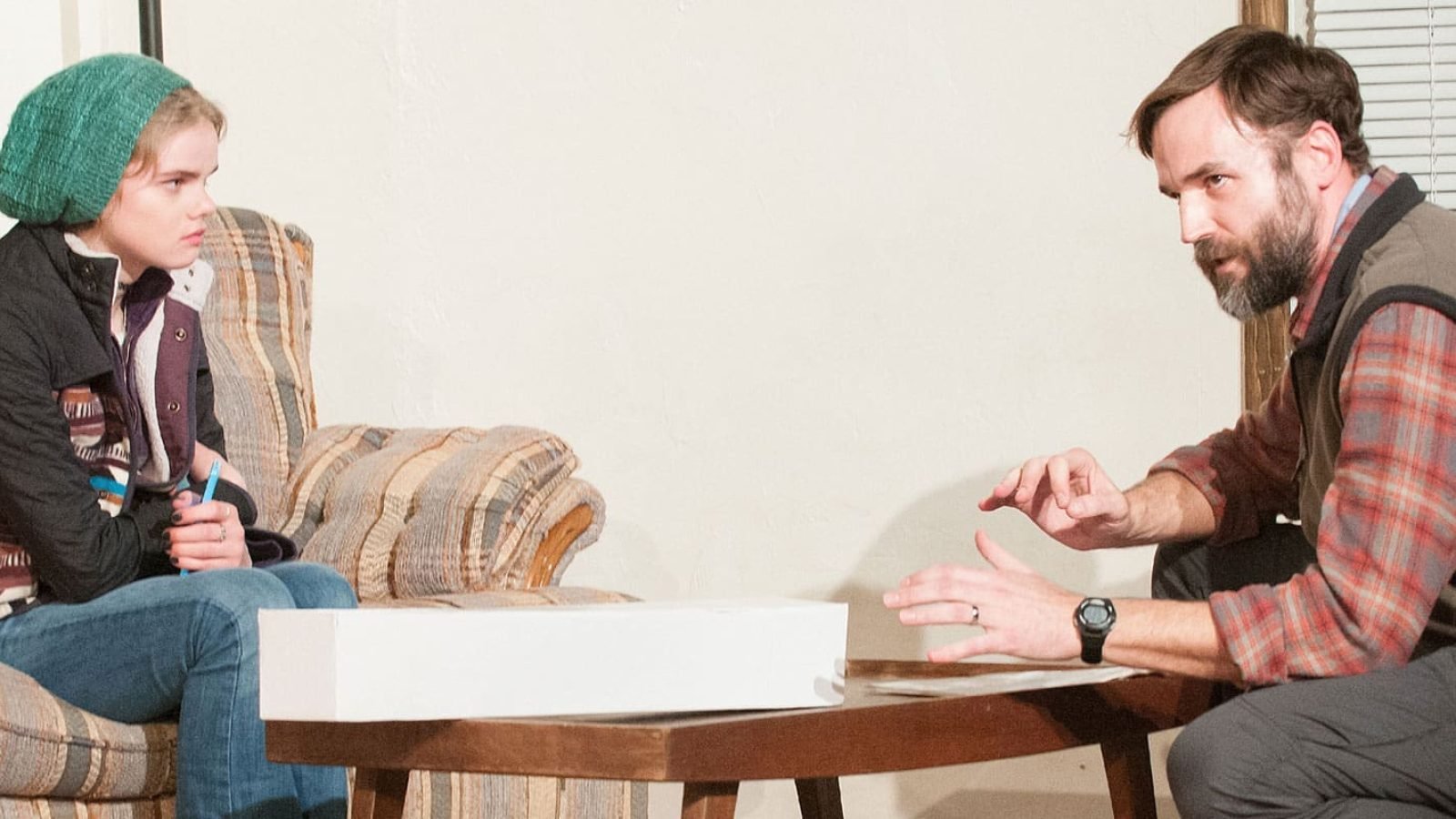 Man and woman in casual clothing having a conversation