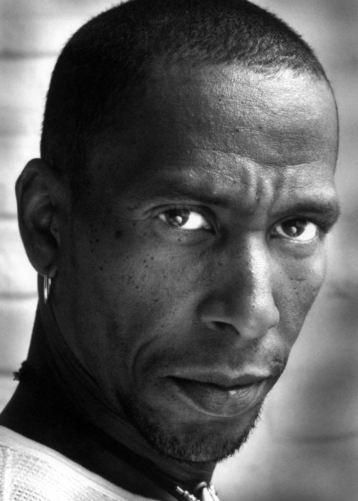 Close-up portrait of Ron Cephas Jones, looking intently at the camera.