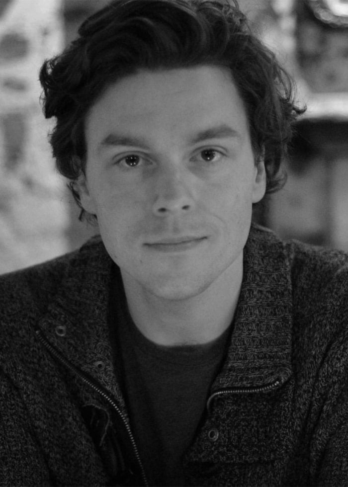 Ryan Emmons looking directly at the camera, wearing a dark sweater.