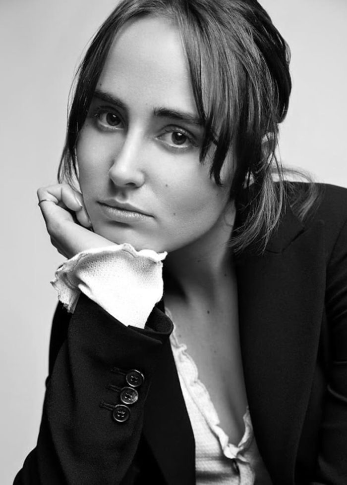Sadie Scott in a black and white portrait, wearing a blazer. Portrait Photography.