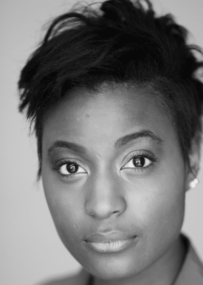 Sydney Sainté portrait: A woman with short, dark hair looks directly at the camera.