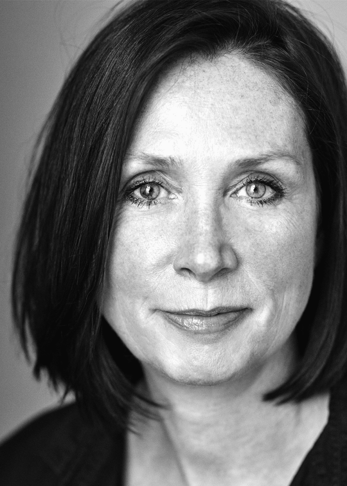 Sally-Rogers Sally Rogers, headshot. Woman with short dark hair, smiling slightly.