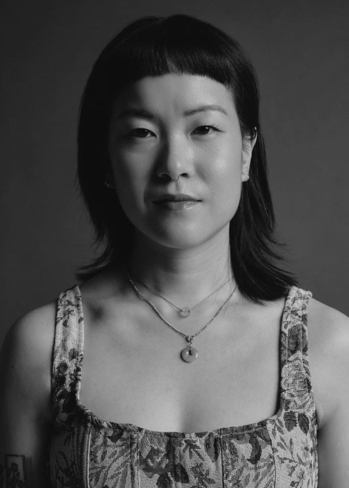 Sami Ma, portrait of a woman with short hair and necklaces