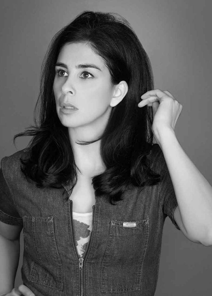 Sarah Silverman poses in a denim shirt, looking thoughtful.