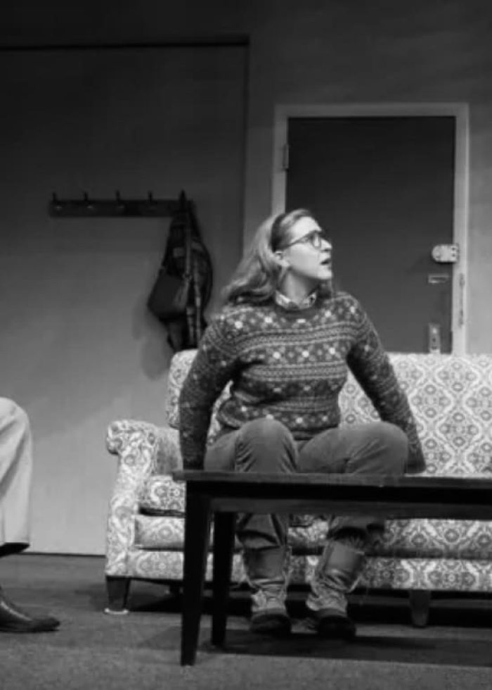 Three actors in a play, seated on a couch and conversing. Review of "Happy Hour".
