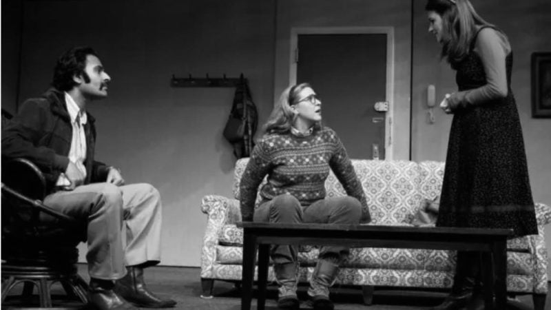 Three actors in a play, seated on a couch and conversing. Review of "Happy Hour".