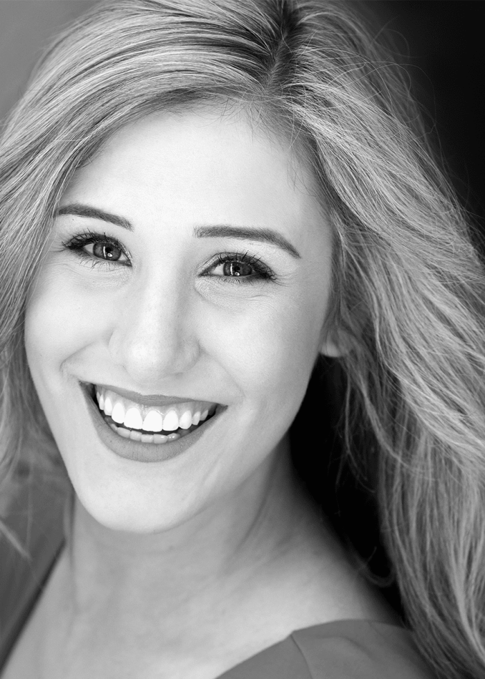 Stephanie Toups smiling with a bright, friendly expression.